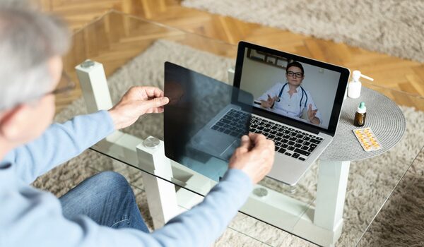 close-up-patient-talking-online-doctor-scaled